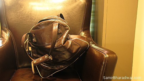 Leather handbag on a leather seat - Widescreen photo