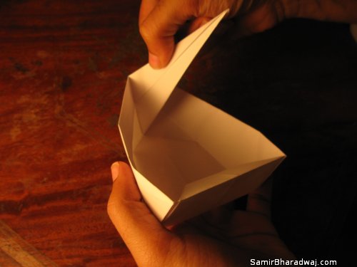 Creasing and folding an origami Diwali lamp - step 24